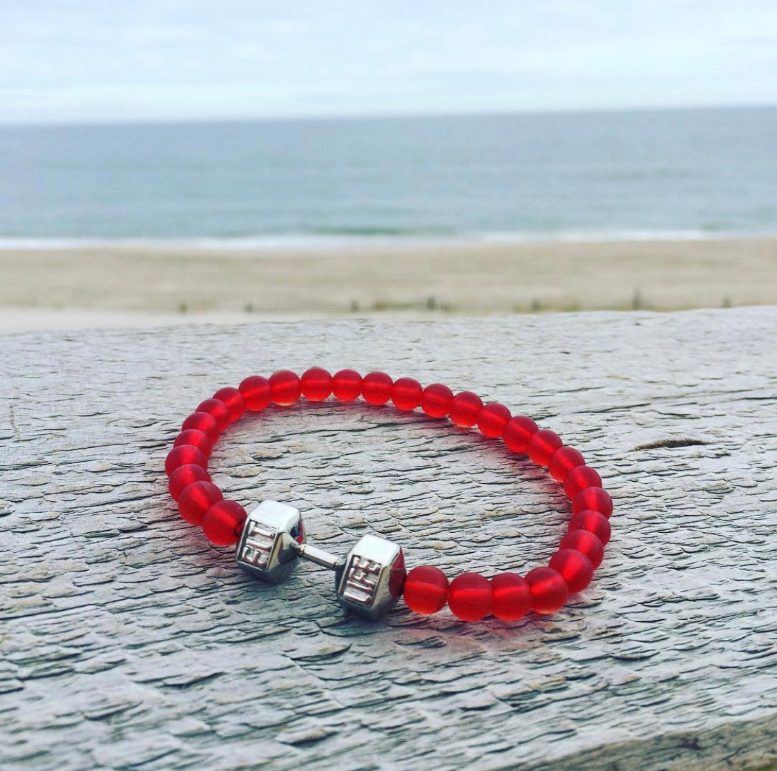 Red dumbbel bracelet
